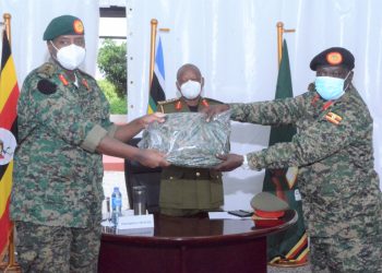 Lt Gen Muhoozi Kainerugaba the new Commandar (UPDF) Land Forces recieving the instruments of power from Maj. Gen Peter Elwelu the new Deputy Chief of Defence Forces at Bombo