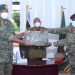 Lt Gen Muhoozi Kainerugaba the new Commandar (UPDF) Land Forces recieving the instruments of power from Maj. Gen Peter Elwelu the new Deputy Chief of Defence Forces at Bombo