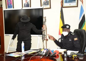 Police shows off the recovered evidence from the scene in Namuwongo