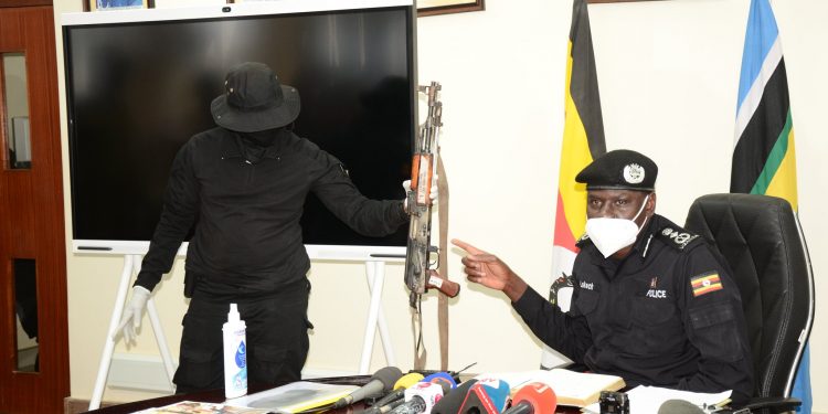 Police shows off the recovered evidence from the scene in Namuwongo